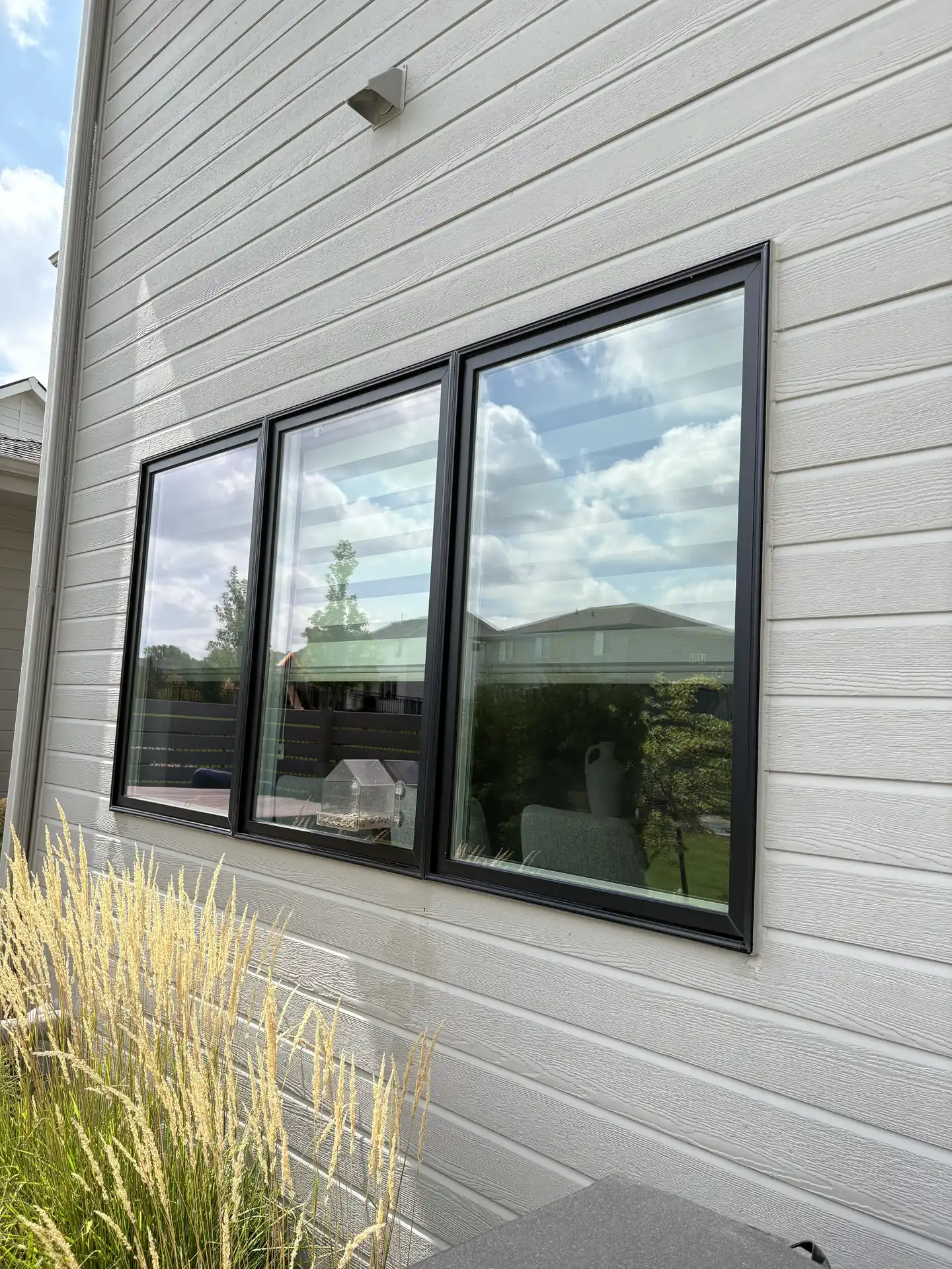 Clean exterior window glass and frame after a professional cleaning