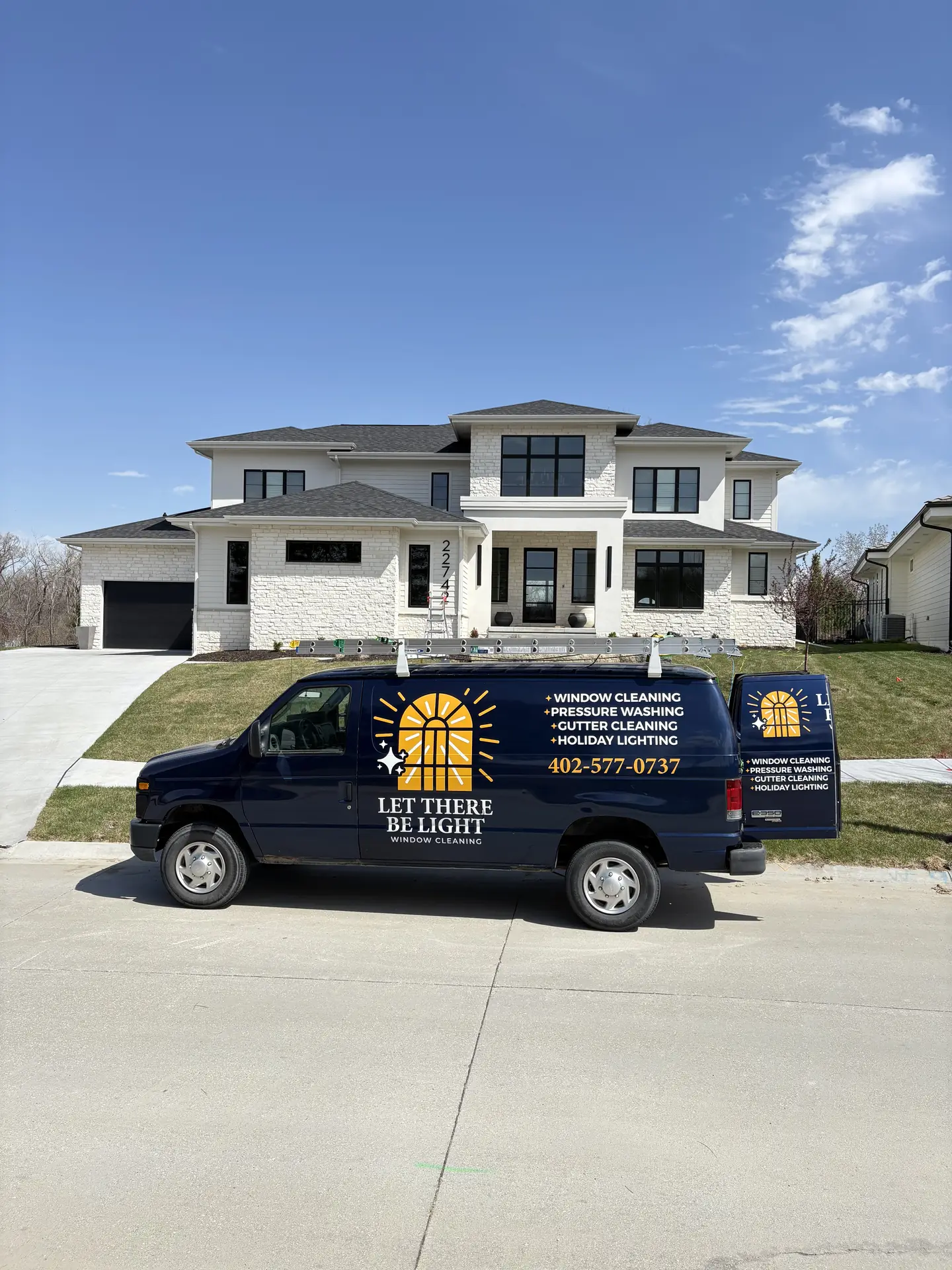 Branded van parked at the curb of a customer's home